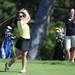 A Huron golfer watches her ball after teeing off during golf regionals at the University of Michigan Golf Course on Thursday. Melanie Maxwell I AnnArbro.com